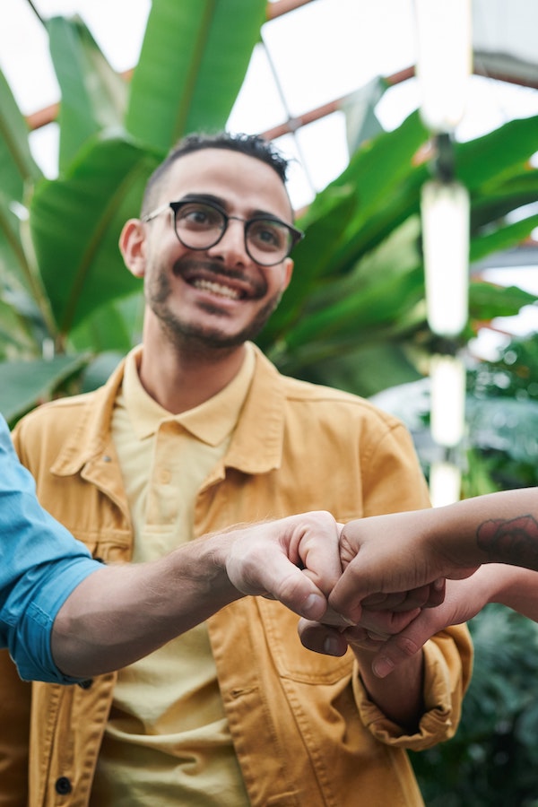 People fist bumping